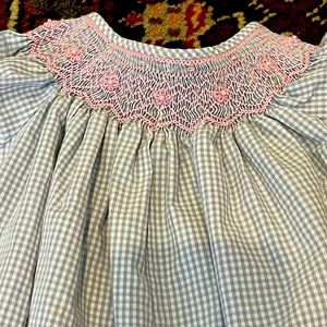 Looks new! Gray/Pink smocked Petit Bebe 18m romper. Snaps in legs
